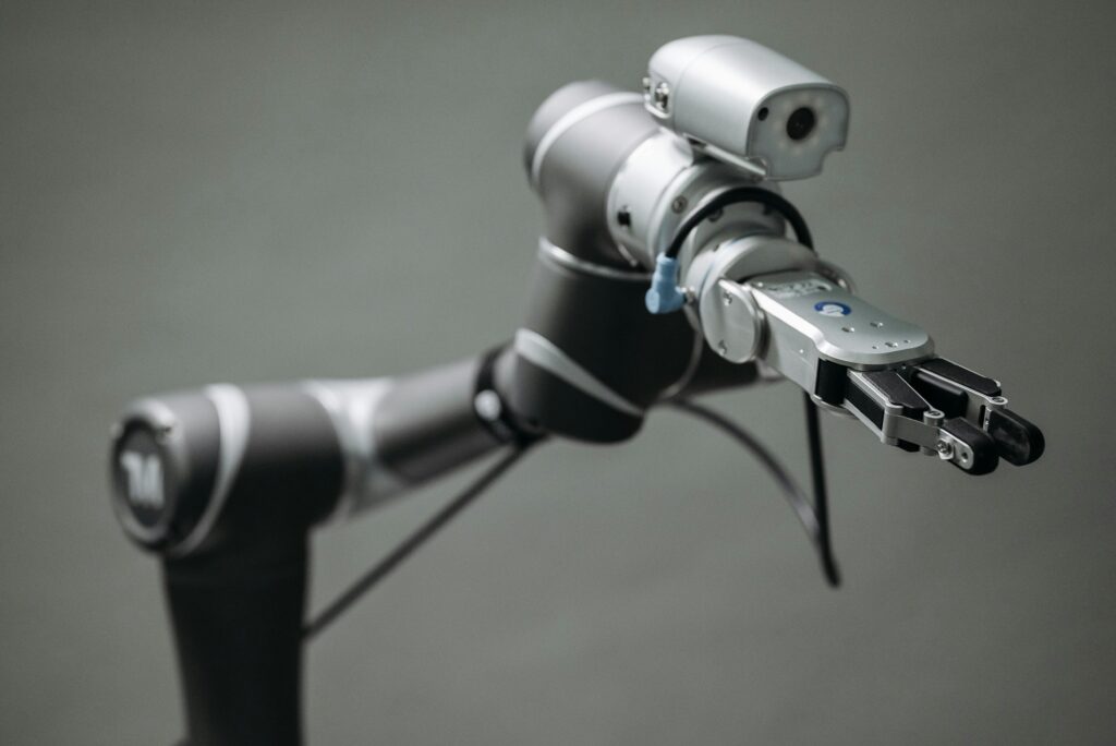 Close-up view of a robotic arm equipped with a video camera, showcasing modern technology.